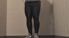 In bathroom with shiny leather leggings