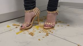 Marina crushes biscuits with her sexy high heel sandals
