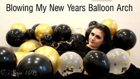 Blowing My New Years Balloon Arch