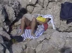 I caught one sassy babe and her trimmed pussy sunbathing on the beach