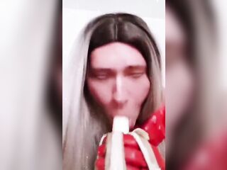 Golden-Haired Crossdresser Deepthroats a banana