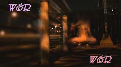 She shows off her boobs by the window