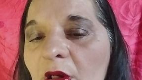 Applying Red Lipstick on My Full Lips in a Black Shirt.