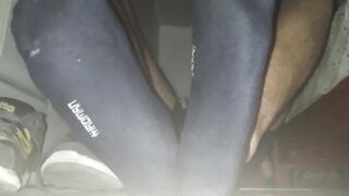 Blue Sweat-soaked socks and barefeet with popshot