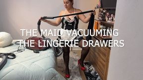 The maid vacuuming the lingerie drawers