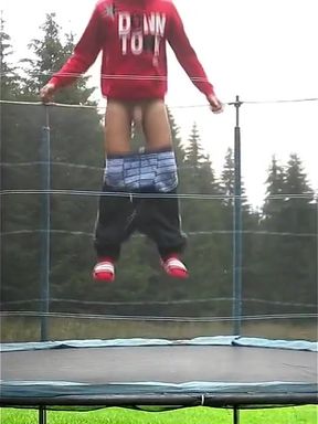 Teen Shows His Big Cock for Fun on a Trampoline at the Camp