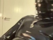 Gagged rubber gimp jerks off