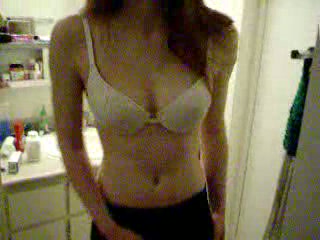 My skinny petite redhead GF in the bathroom in her bra