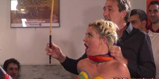 Busty blonde dances through Pride parade in revealing outfit