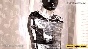 Fejira com Full body wrapped in tight latex clothing and plastic wrap