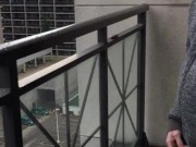 Skinny exhibitionist shows boner on public Toronto balcony while smoking