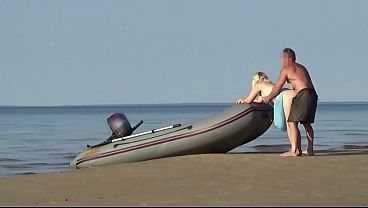 MILF blonde beach babe takes it in the sand