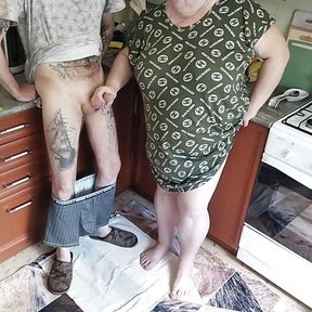 a fat woman jerks off my dick in the kitchen and I cum powerfully