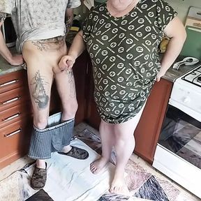 a fat woman jerks off my dick in the kitchen and I cum powerfully