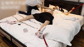 GG38 - Cute Asian girl in short skirt and stockings is bound to the bed and tickled.