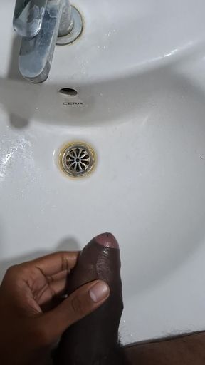 Peeing while jerking in bathroom