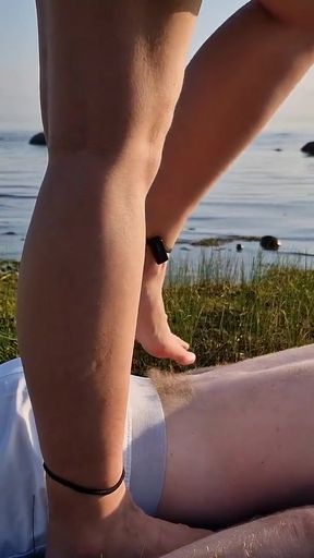 Foot massage by girl with long toes, long slim legs in skirt   Clip 3