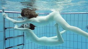 Cute teen chick Anna Netrebko swims naked with her GF