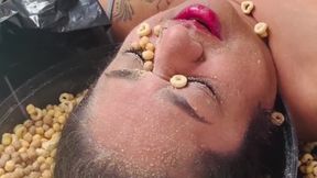 Masala enjoys her cereal and milk on her face!