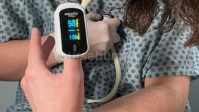 Pulse Oximeter and White Stethoscope Stimulation Testing with Vibrator in Patient Gown 720p