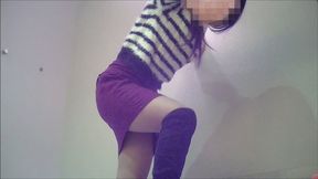 A young woman in boots plays aggressively, stepping on a man.