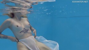 Finnish sexy girl swims nude in the pool