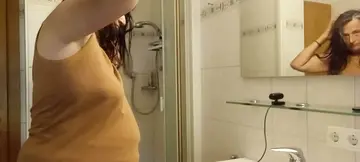 German amateur MILF poses naked in the shower