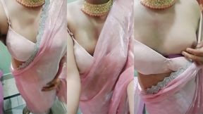 Indian Gay Crossdresser Gaurisissy pressing and playing with her big boobs in pink saree looking like a horny housewife