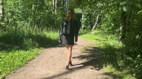 girl walking through the woods in high-heeled shoes and twisted her leg, she very hurt