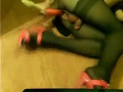 Sissy shemale slut in brown pantyhose, green dress, red heals, long dildo