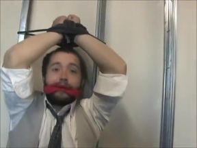 Young businessman tied up and gagged.