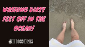 Cleaning my dirty feet off at the beach