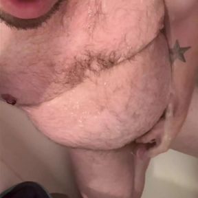 Uncut gay bear pisses in the toilet and on himself in the shower