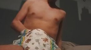 Diaper boy eats his own cum