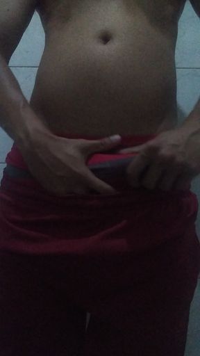 Showing off his big, thick cock in shorts and red underwear