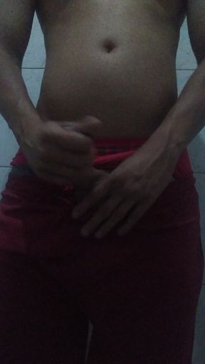 Showing off his big, thick cock in shorts and red underwear