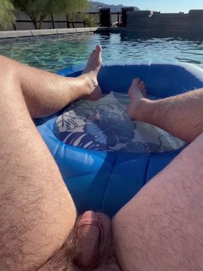 Amateur POV shows cock in swimming pool while feet play with toesies