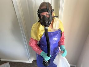 HAZMAT HOUSEWIFE CLEANS VACUUM