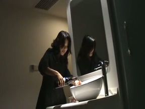 Naughty playful Chinese girl masturbating with a bottle