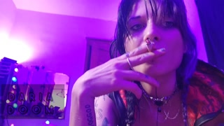 gorgeous goth puffs on her cigarette for you