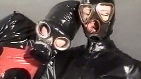 Insane fetish action with two sluts in latex body and gasmasks