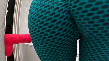Liz Rainbow grinding a dildo wearing her tight leggins