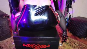 Dominatrix Eva in latex fetish gear licks her slave's twat