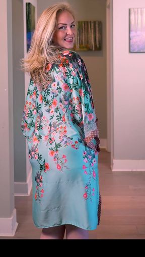 Pink babydoll robe falls off her shoulders
