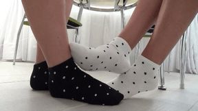 footsie in socks and wiggling toes So