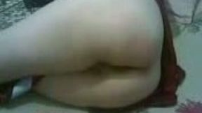 Tajik wife closes her face while her husband tries to film her