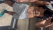 Alpha male displaying huge cock in shorts without underwear