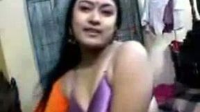 Chubby slutty happy smiling Indian brunette poses in her purple stuff