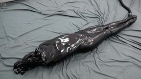 Bondage in a black vacuum cocoon