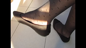 brown suede ballet flats and patterned pantyhose, public shoeplay by Isabelle-Sandrine